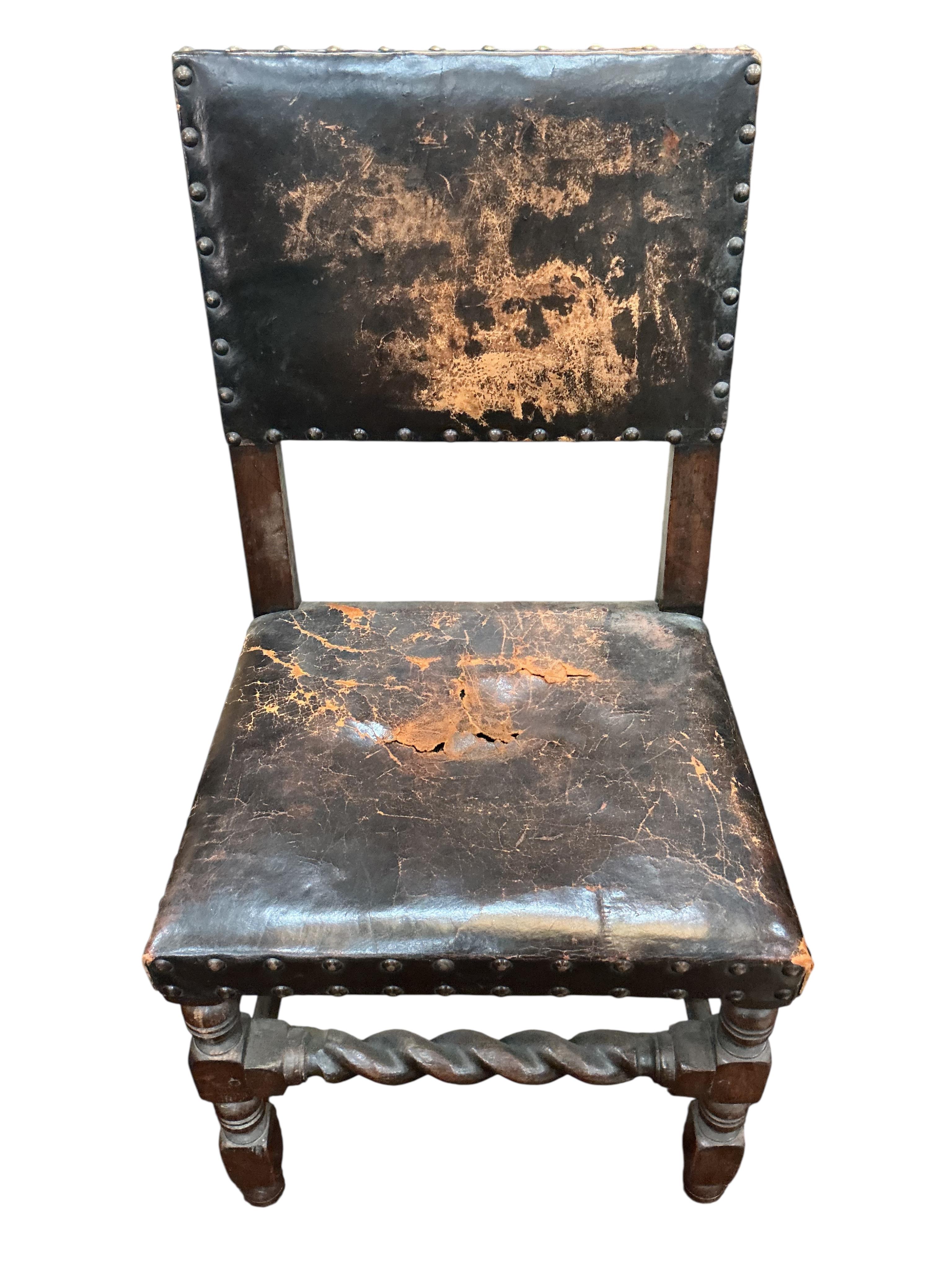 A set of eight Tudor style oak dining chairs, two with arms